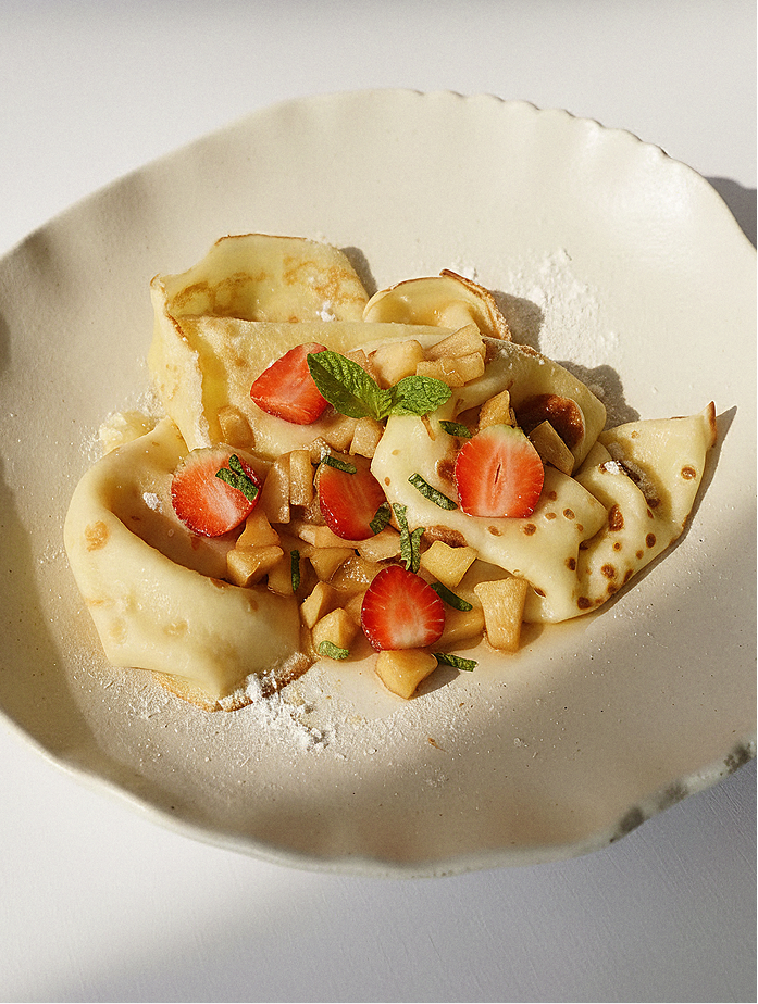 Crepes with caramelized apple, cinnamon & fresh strawberries